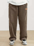 Autumn and winter men's corduroy casual pants with leather label decoration, solid color pockets, straight leg pants suitable fo